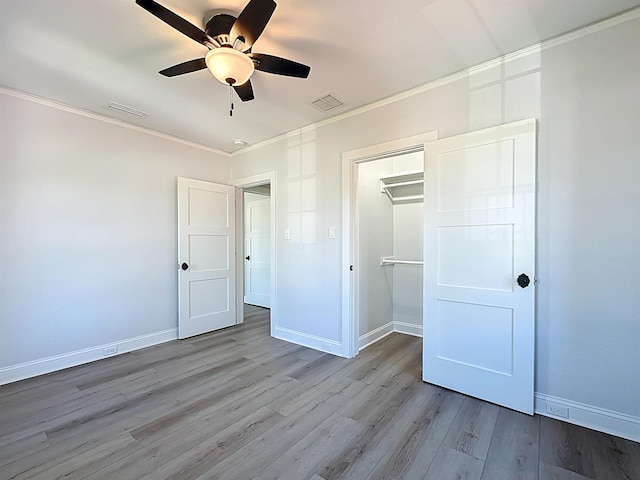 307 Minorca Ave, Saint Augustine, FL 32080 - unfurnished bedroom with visible vents, crown molding, and wood finished floors