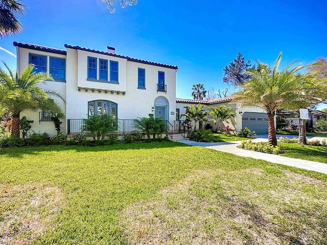 307 Minorca Ave, Saint Augustine, FL 32080 - mediterranean / spanish home featuring stucco siding, a front lawn, driveway, a garage, and a chimney
