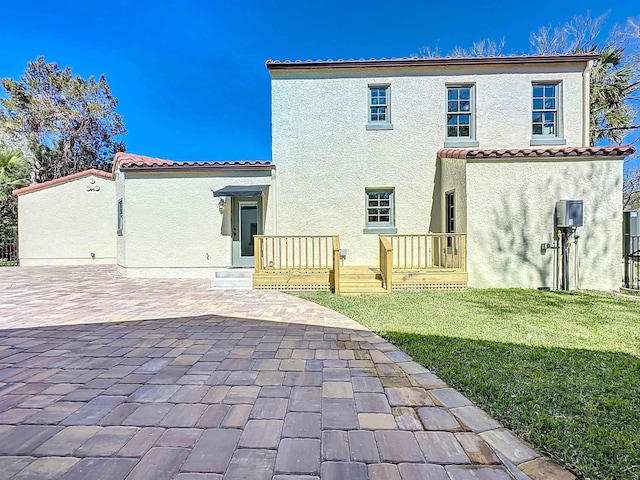 307 Minorca Ave, Saint Augustine, FL 32080 - back of property featuring a tiled roof and stucco siding