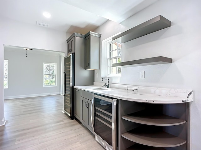 307 Minorca Ave, Saint Augustine, FL 32080 - kitchen with open shelves, beverage cooler, a wealth of natural light, and a sink