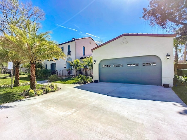 307 Minorca Ave, Saint Augustine, FL 32080 - mediterranean / spanish-style home with stucco siding, concrete driveway, and an attached garage