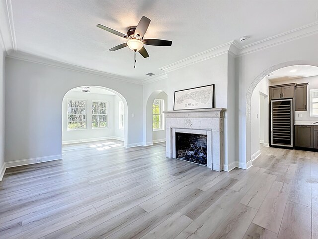 307 Minorca Ave, Saint Augustine, FL 32080 - unfurnished living room featuring wood finished floors, a fireplace, visible vents, and a healthy amount of sunlight