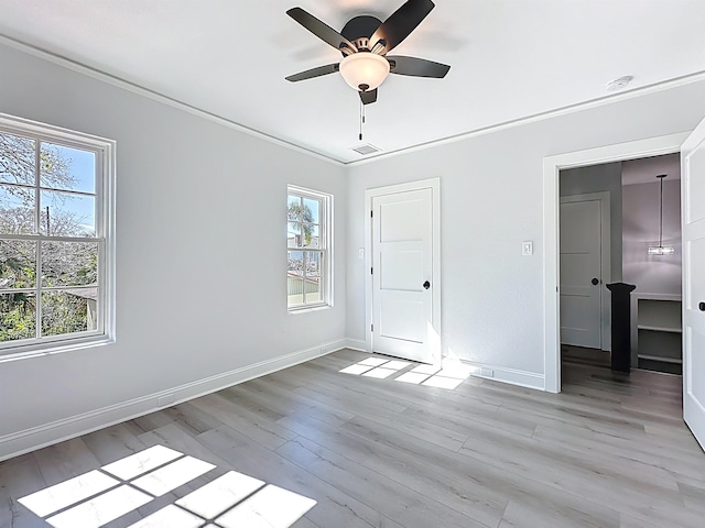 307 Minorca Ave, Saint Augustine, FL 32080 - unfurnished bedroom with visible vents, baseboards, light wood-style flooring, and ornamental molding