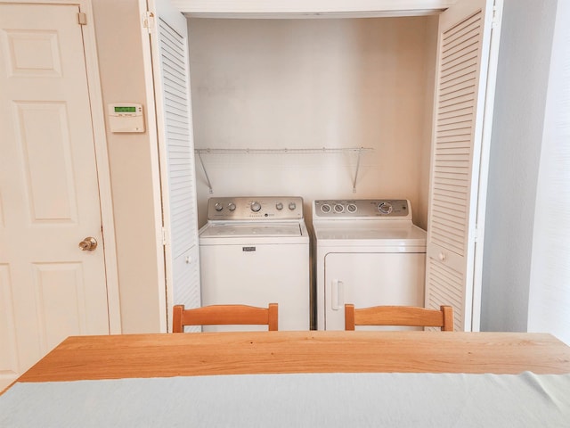 laundry room featuring washing machine and clothes dryer