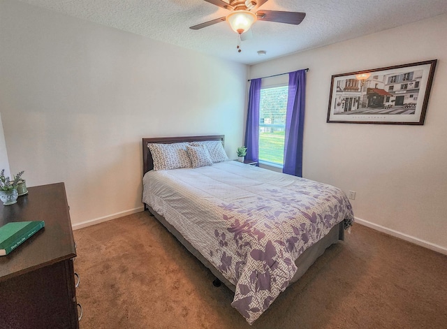 bedroom featuring carpet flooring, ceiling fan, and a textured ceiling