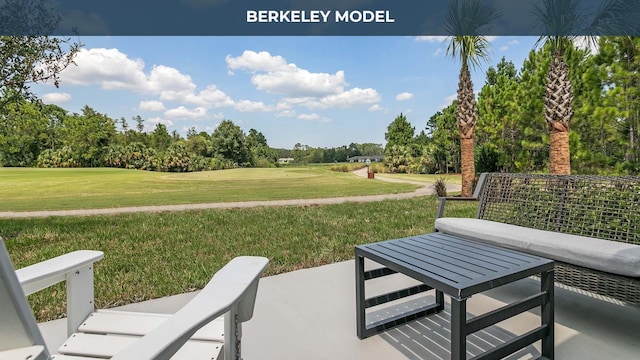 view of community with a lawn and a patio area