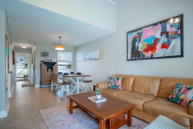 living room featuring light tile patterned floors and baseboards