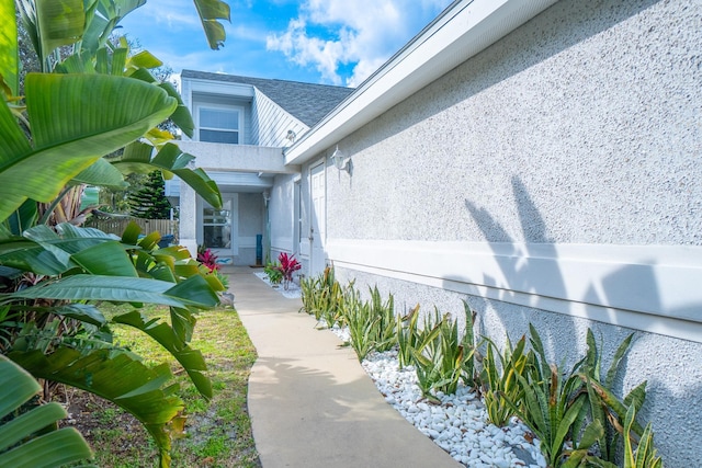entrance to property with stucco siding