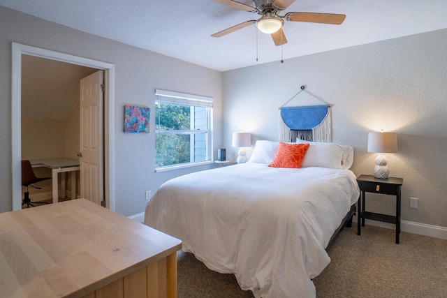 bedroom featuring carpet flooring, baseboards, a ceiling fan, and a textured wall