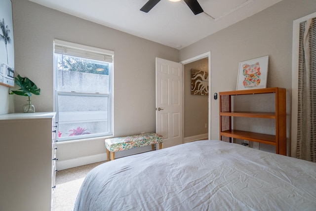 bedroom featuring carpet floors, a ceiling fan, and baseboards