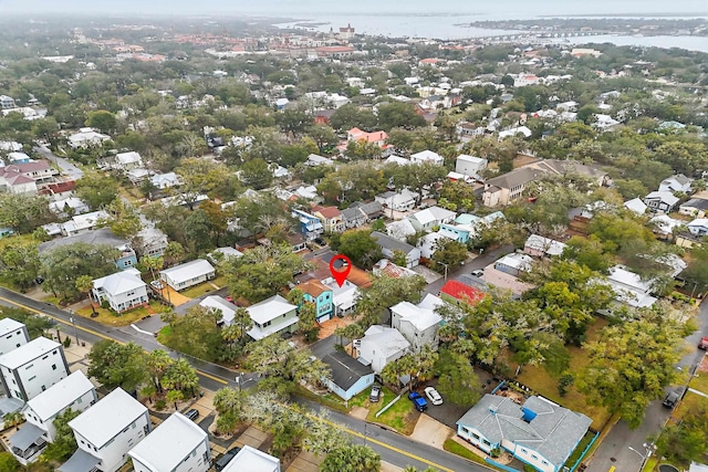 drone / aerial view with a water view and a residential view