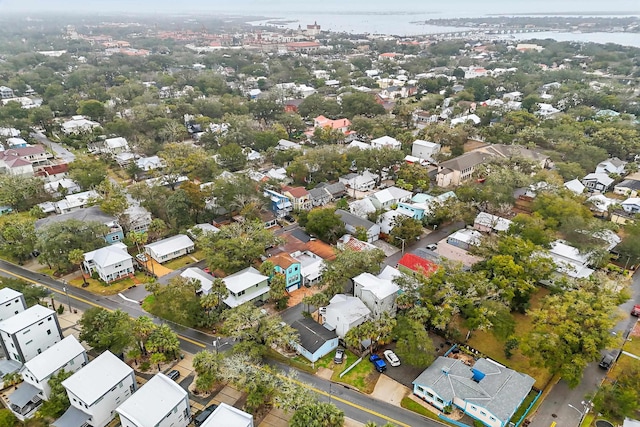 drone / aerial view featuring a water view and a residential view