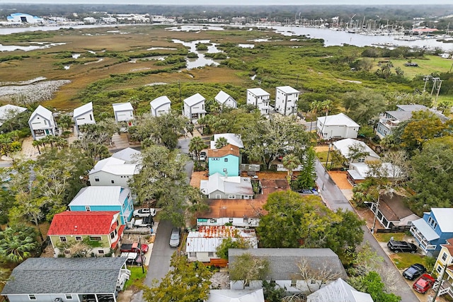 birds eye view of property featuring a water view and a residential view