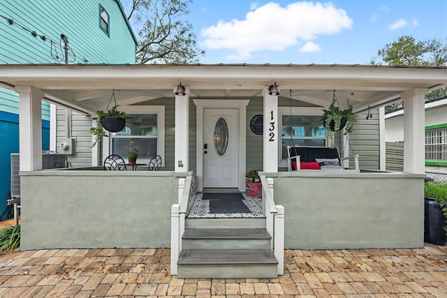 property entrance with covered porch