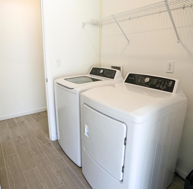 washroom featuring washer and clothes dryer