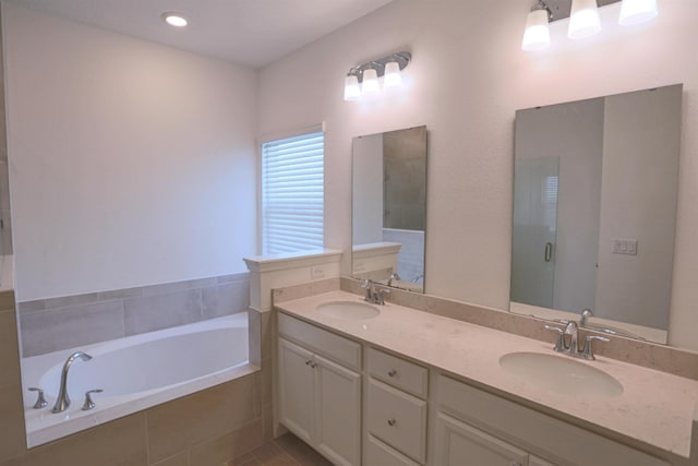 bathroom featuring vanity and plus walk in shower