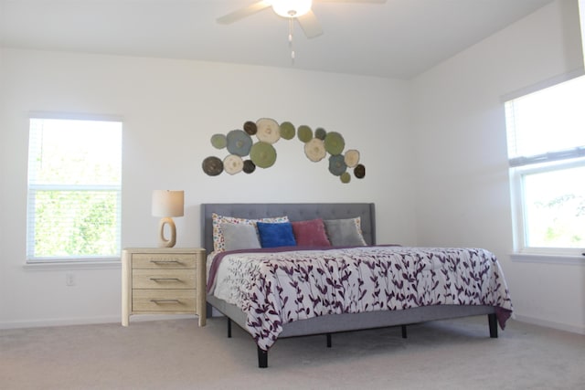 bedroom with ceiling fan and carpet