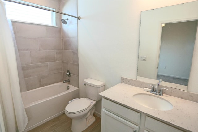 full bathroom featuring vanity, shower / tub combo, and toilet