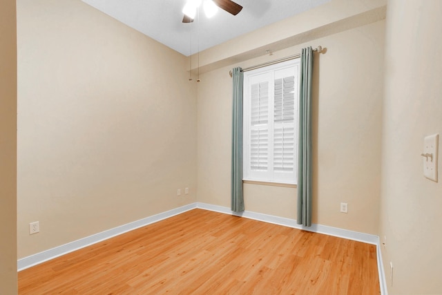 spare room featuring ceiling fan and wood-type flooring