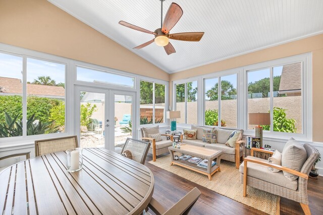 sunroom featuring ceiling fan, french doors, a healthy amount of sunlight, and lofted ceiling