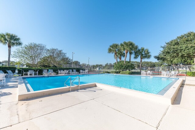 view of swimming pool featuring a patio