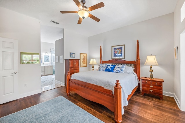 bedroom with connected bathroom, ceiling fan, and dark hardwood / wood-style floors