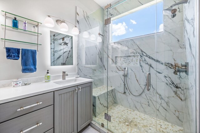 bathroom with vanity and walk in shower