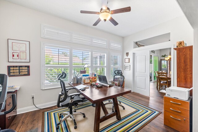 office space featuring ceiling fan and dark wood-type flooring