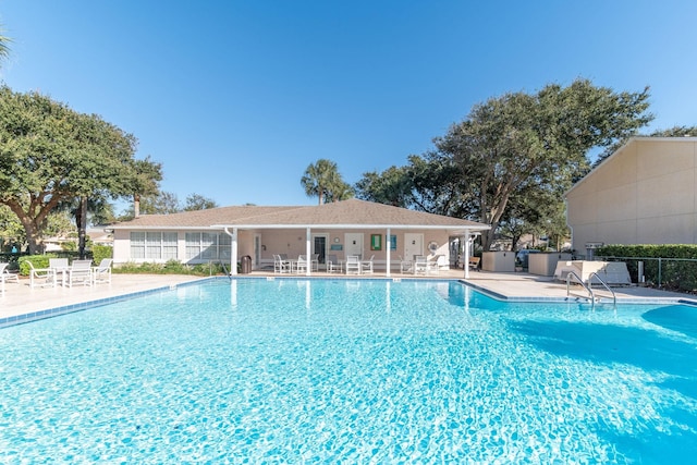 view of swimming pool with a patio area