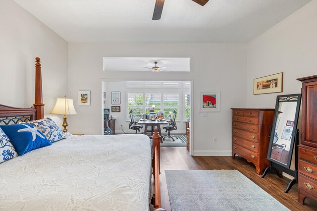 bedroom featuring ceiling fan and dark hardwood / wood-style flooring