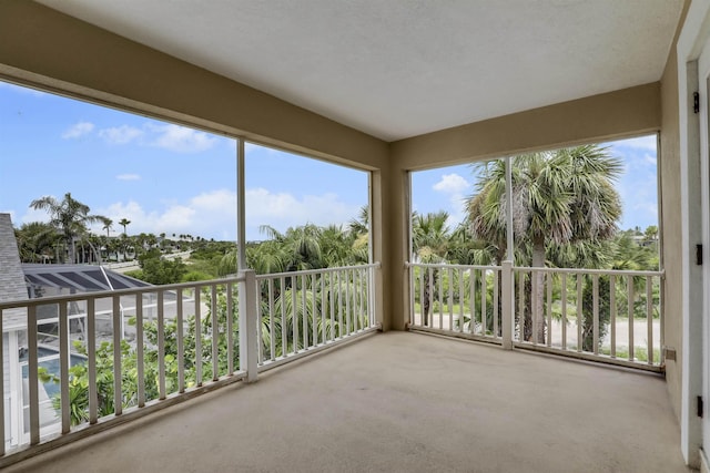 9162 August Cir, Saint Augustine, FL 32080 - unfurnished sunroom featuring carpet flooring