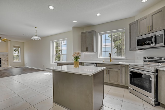 9162 August Cir, Saint Augustine, FL 32080 - kitchen featuring appliances with stainless steel finishes, healthy amount of natural light, a kitchen island, open floor plan, and recessed lighting