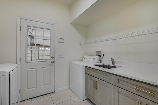 9162 August Cir, Saint Augustine, FL 32080 - laundry room featuring washing machine and clothes dryer, cabinet space, and light tile patterned floors