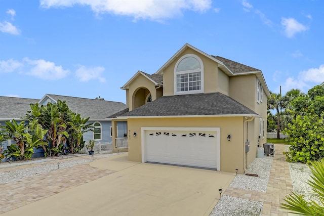 9162 August Cir, Saint Augustine, FL 32080 - traditional-style house featuring driveway, stucco siding, a garage, and a shingled roof