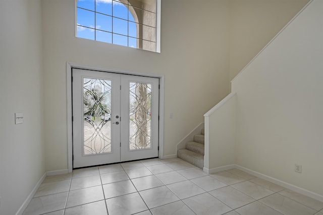 9162 August Cir, Saint Augustine, FL 32080 - tiled foyer entrance featuring plenty of natural light, french doors, stairway, and a high ceiling