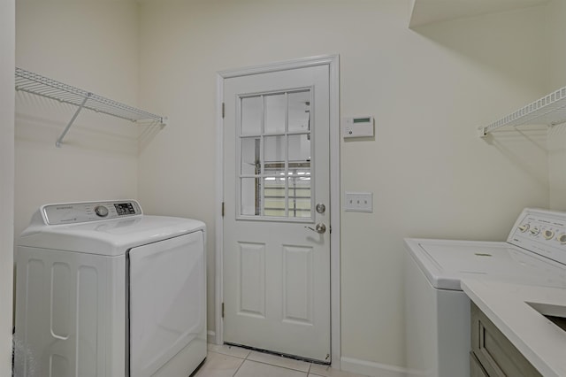 9162 August Cir, Saint Augustine, FL 32080 - washroom with washing machine and clothes dryer and light tile patterned floors
