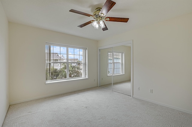 9162 August Cir, Saint Augustine, FL 32080 - unfurnished bedroom featuring carpet flooring, a closet, and ceiling fan