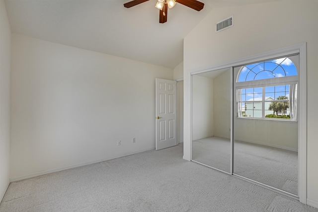 9162 August Cir, Saint Augustine, FL 32080 - unfurnished bedroom featuring carpet, vaulted ceiling, a closet, and a ceiling fan