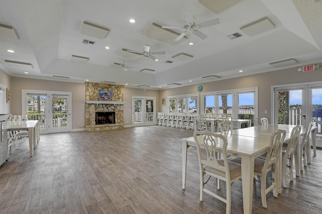 9162 August Cir, Saint Augustine, FL 32080 - dining area with a tray ceiling, french doors, wood finished floors, recessed lighting, and a ceiling fan