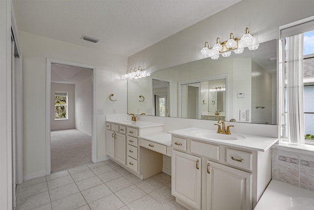 9162 August Cir, Saint Augustine, FL 32080 - full bathroom with double vanity, plenty of natural light, tile patterned floors, and a bath