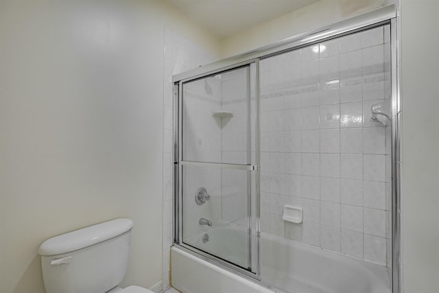 9162 August Cir, Saint Augustine, FL 32080 - bathroom featuring toilet and combined bath / shower with glass door