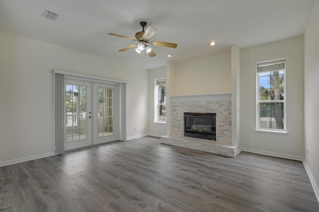 9162 August Cir, Saint Augustine, FL 32080 - unfurnished living room with plenty of natural light, french doors, dark wood-style floors, ceiling fan, and recessed lighting