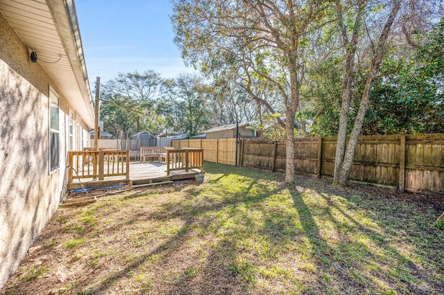 view of yard with a deck