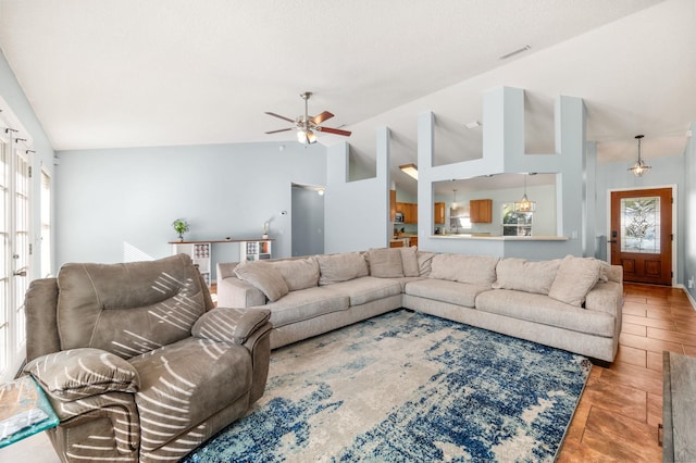 living room with vaulted ceiling and ceiling fan