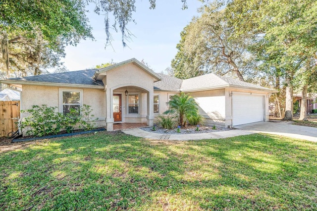 ranch-style house featuring a garage and a front lawn