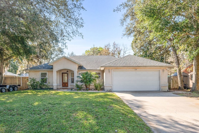 ranch-style house featuring a garage and a front yard