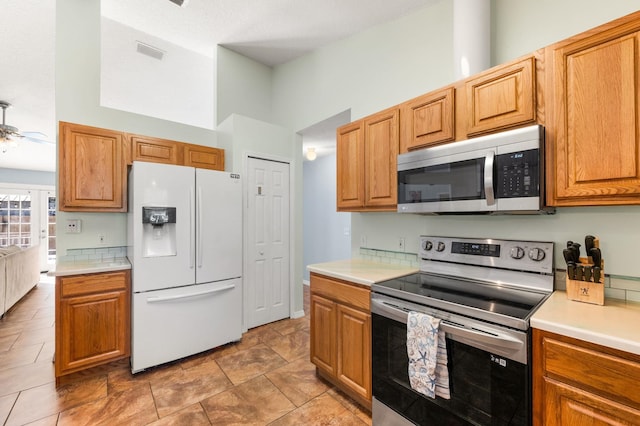 kitchen with stainless steel appliances and ceiling fan