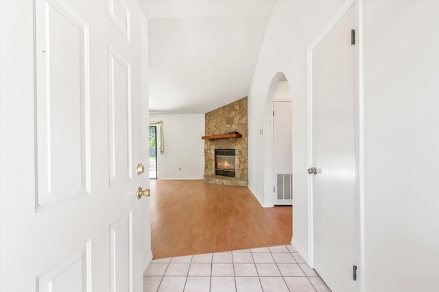 hallway with visible vents and light tile patterned floors