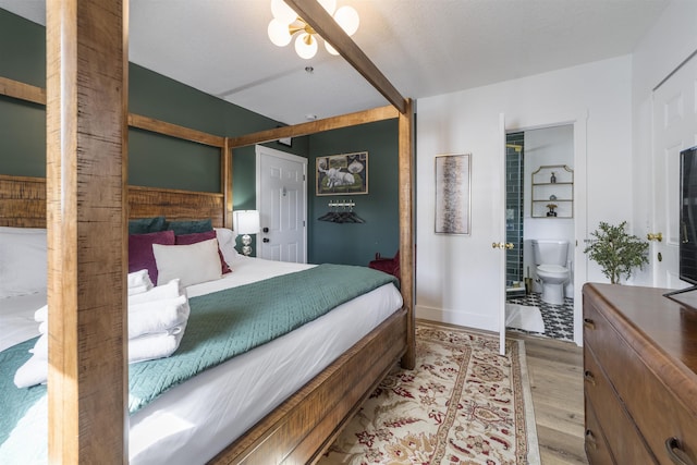 2 Mulvey St, Saint Augustine, FL 32084 - bedroom featuring light wood-style floors and connected bathroom