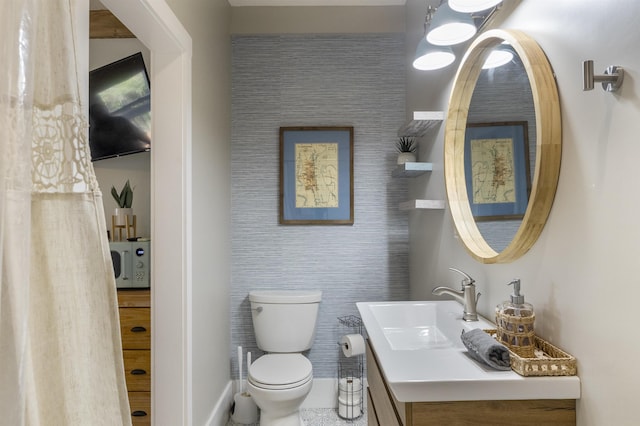 bathroom with vanity and toilet